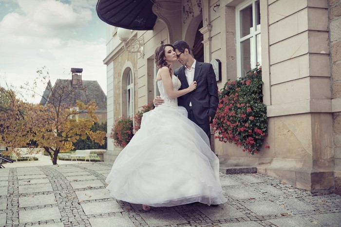 Bride and Groom in front of a building