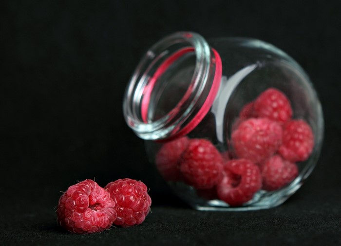 Raspberries in a glass jar