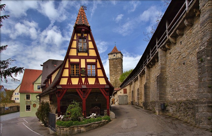 Half-timbered house and medieval wall in Rothenburg ob der Tauber, Germany