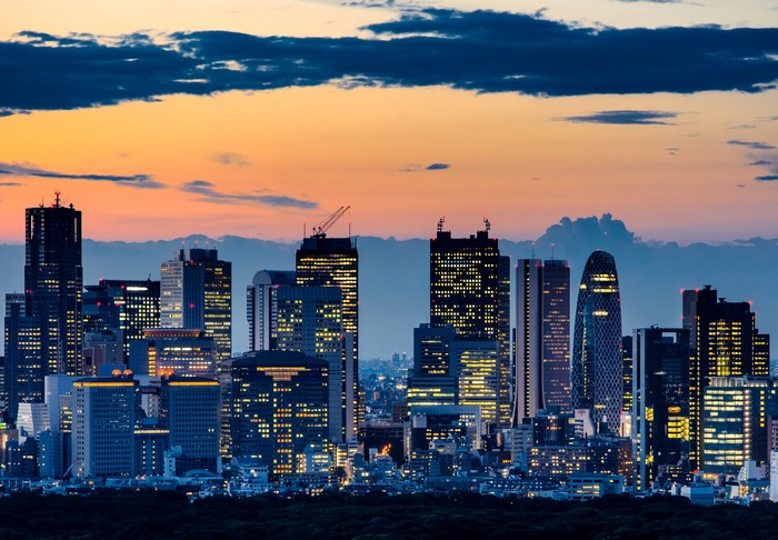Tokyo skyline at dusk with illuminated skyscrapers