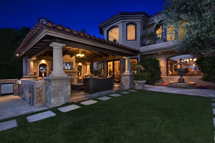 Luxury Mansion Outdoor Kitchen and Patio at Night