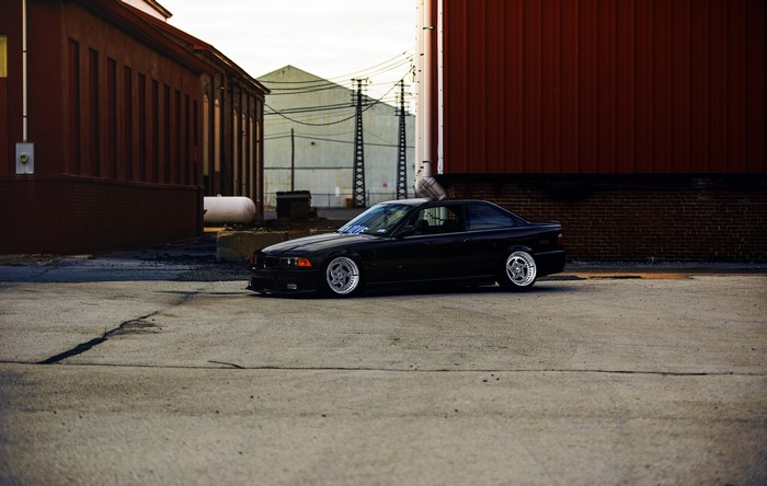 Black BMW E36 on Asphalt