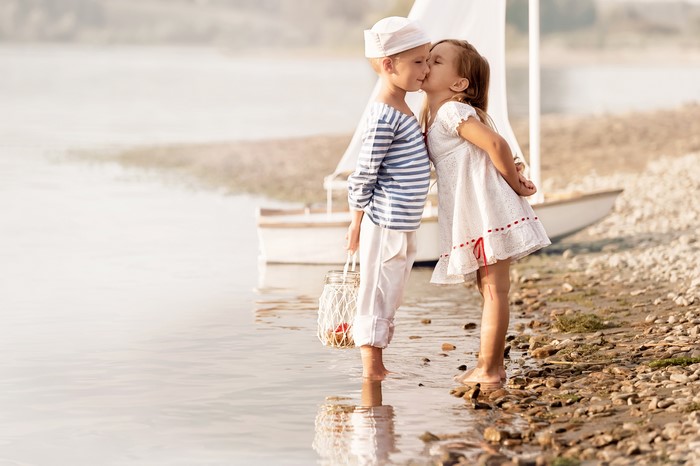 Boy and Girl Kissing by the Water