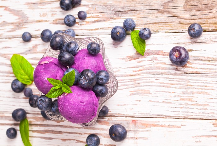 Blueberry ice cream with fresh blueberries and mint