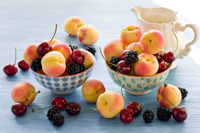 Peaches, Cherries, and Blackberries in Bowls with a Jug