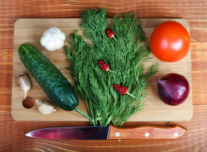 Vegetables and knife on a cutting board