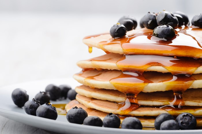 Stack of Pancakes with Blueberries and Honey