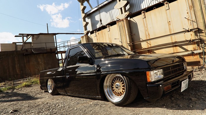 Black Datsun Pickup Truck with Custom Wheels