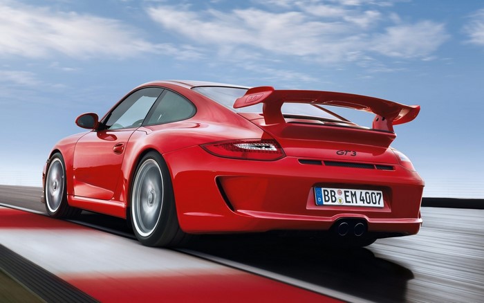 Red Porsche 911 GT3 997 on a Racetrack