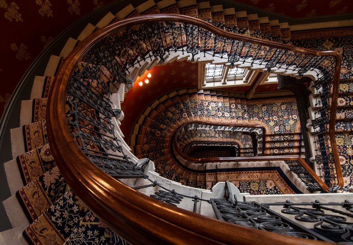 Ornate Spiral Staircase with Persian Rugs