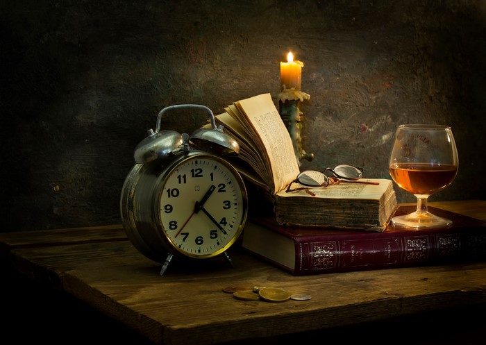 Vintage Clock and Candlelit Books