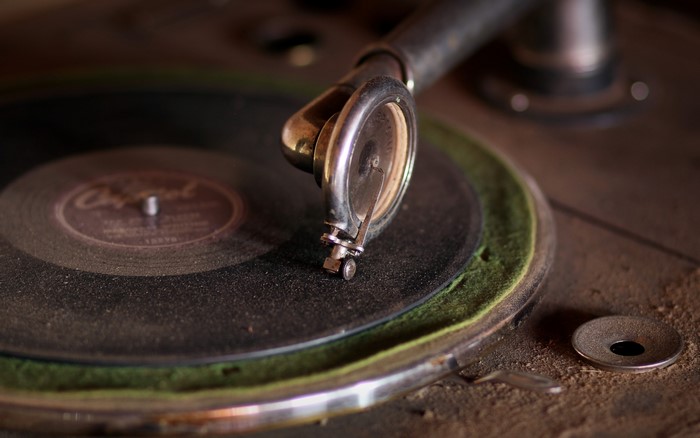 Close-up of a vintage phonograph with a record