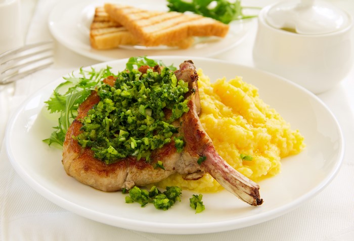 Pork chop with mashed potatoes and salad