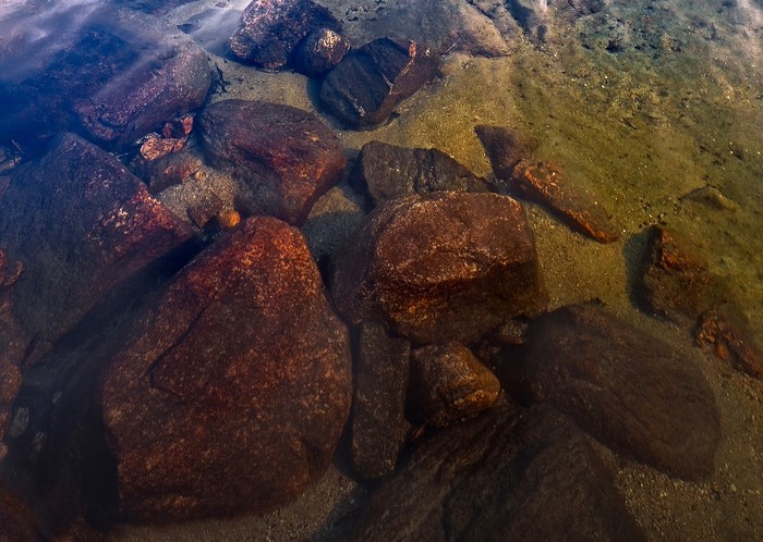 Rocks submerged in clear water