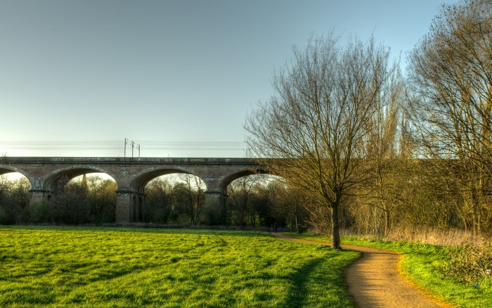 Train viaduct over a grassy field in Hanwell, London