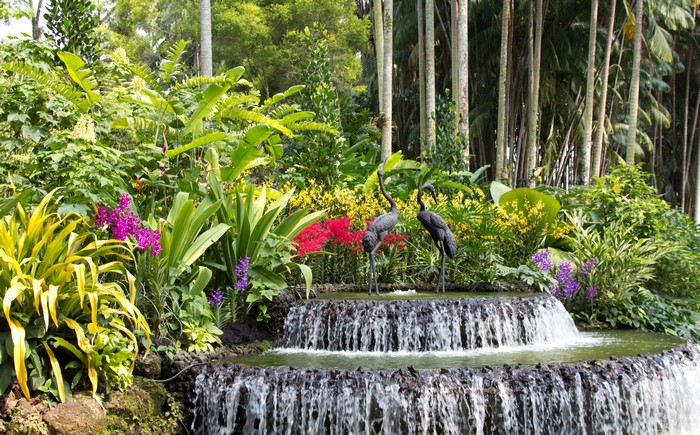 Two crane sculptures in a tiered fountain at Singapore Botanic Gardens
