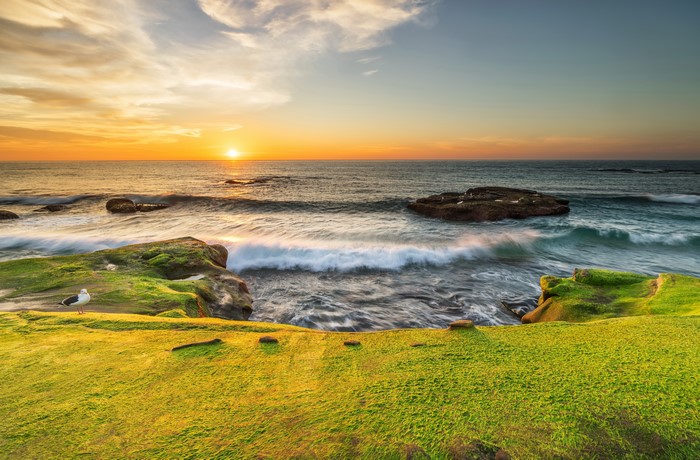 Sunset over the ocean coast in California