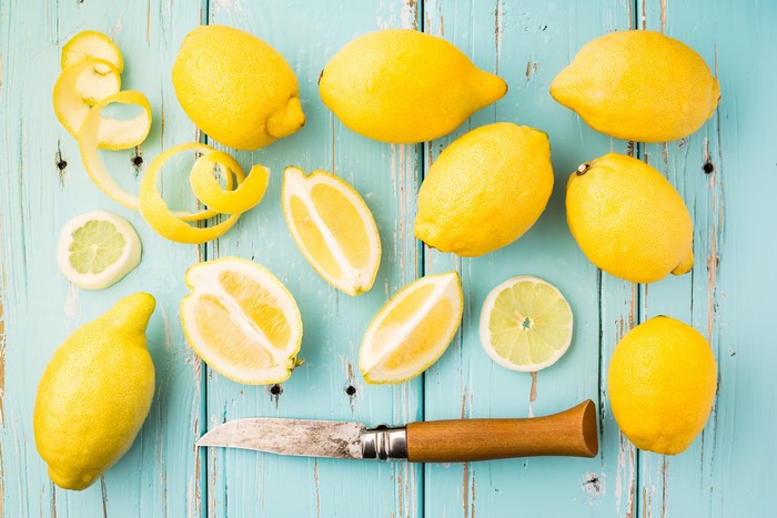 Lemons and Knife on Blue Wooden Table