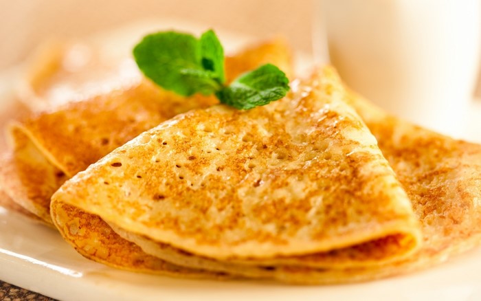 Close-up of stacked pancakes with mint leaf