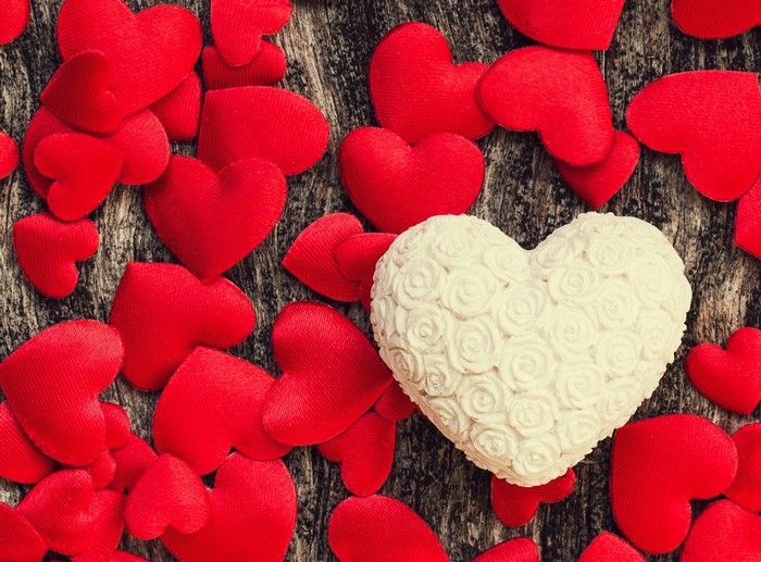 Valentine's Day red and white hearts on wood
