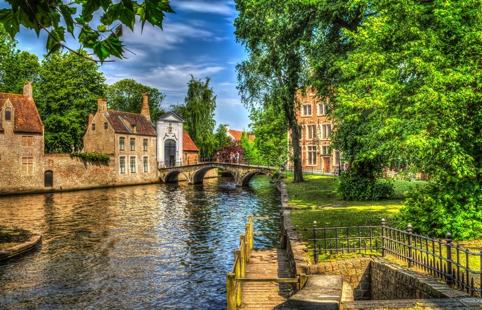 Canal in Bruges, Belgium with historic houses and bridge