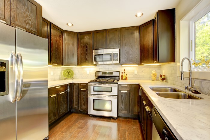 Modern Dark Wood Kitchen with Stainless Steel Appliances