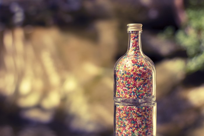 Bottle filled with colorful sprinkles