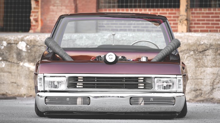 Violet Nissan Pickup Truck with Exposed Engine