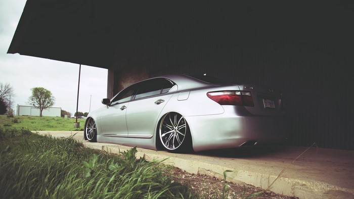 Silver Lexus LS600 parked under a structure