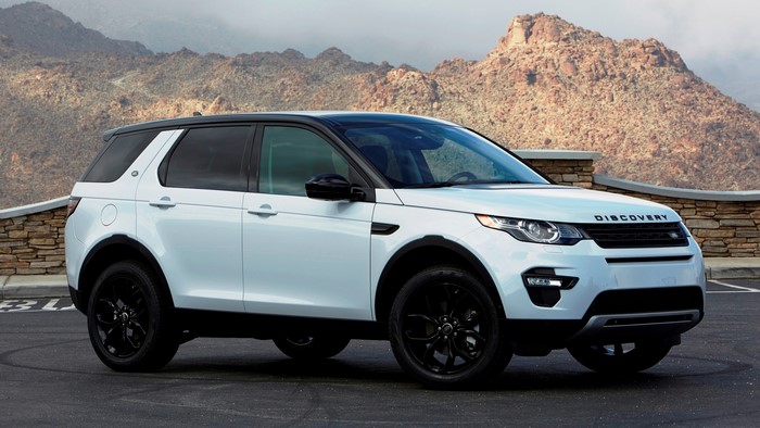 White Land Rover Discovery Sport HSE with Mountains