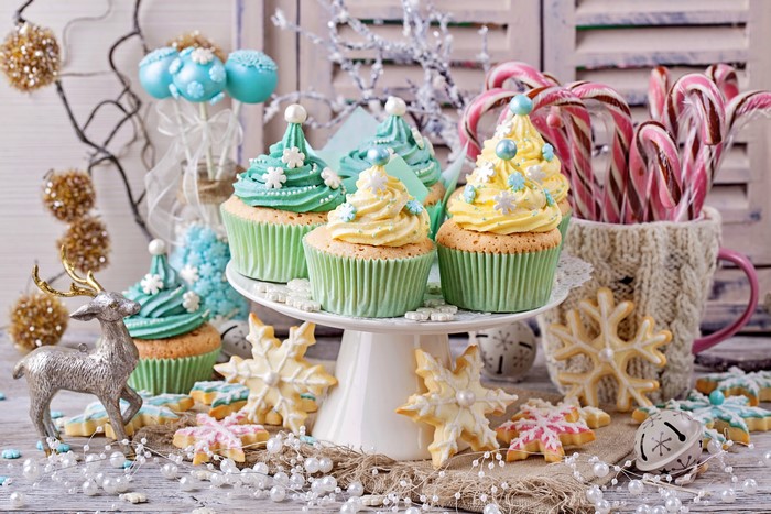 Christmas cupcakes and cookies with reindeer and candy canes