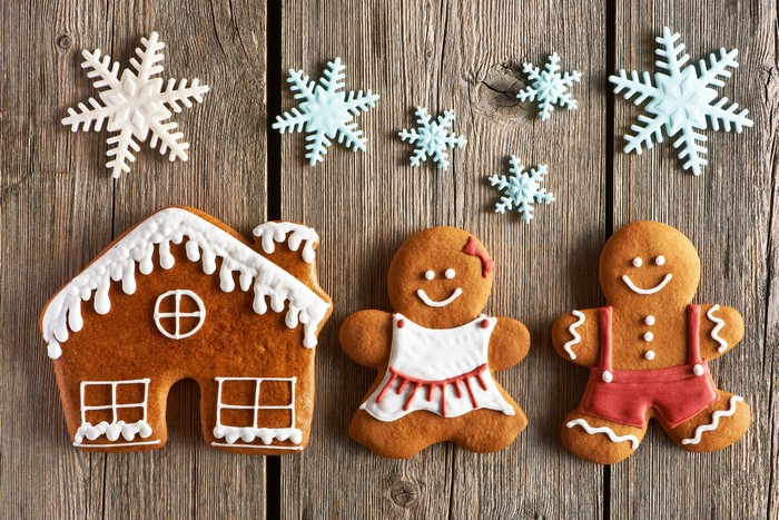 Gingerbread house and gingerbread people with snowflakes