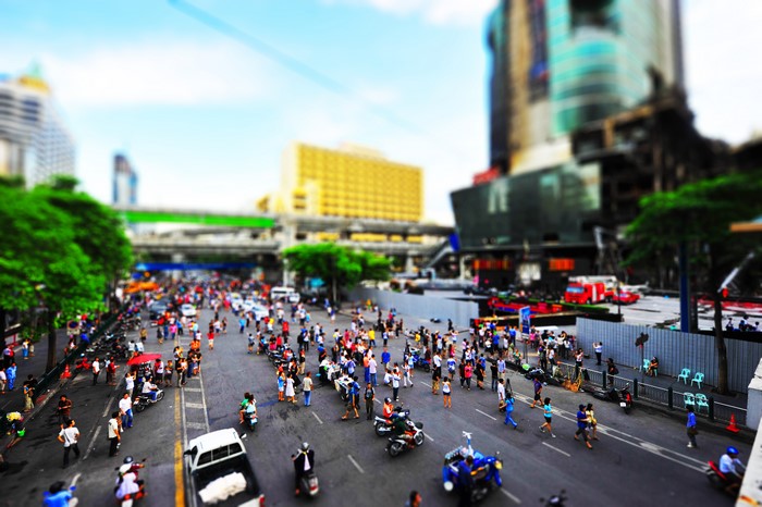 Busy Asian street with people and vehicles