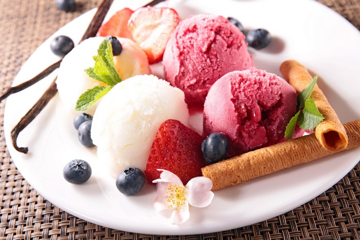 Ice cream with strawberries, blueberries, and vanilla beans