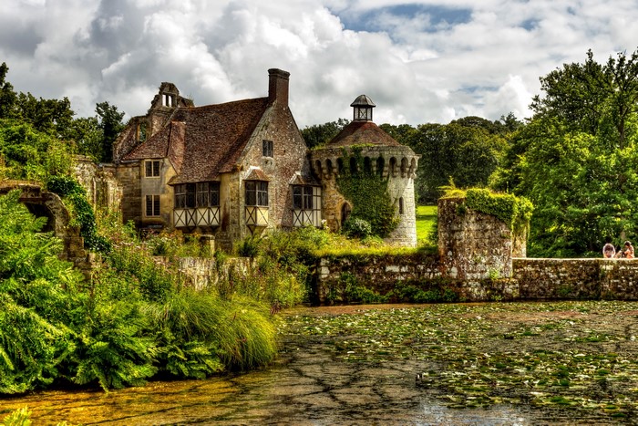 Scotney Castle ruins with a pond in England