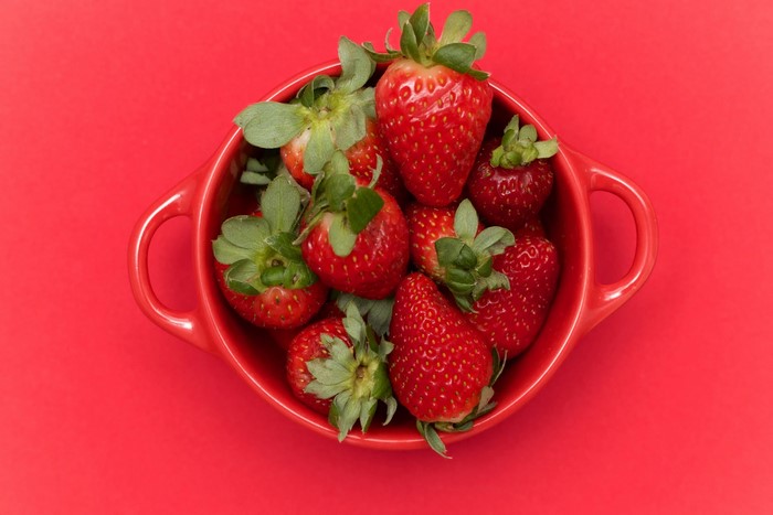 Strawberries in a red bowl