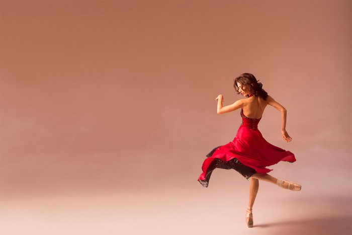 Ballerina in a red dress performing ballet