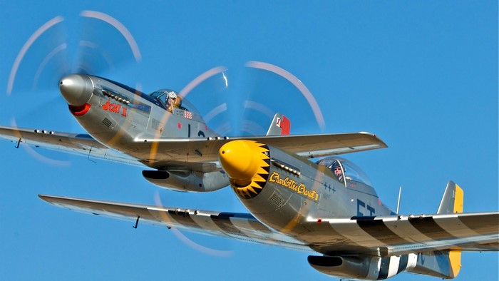 Two P-51 Mustang airplanes in flight