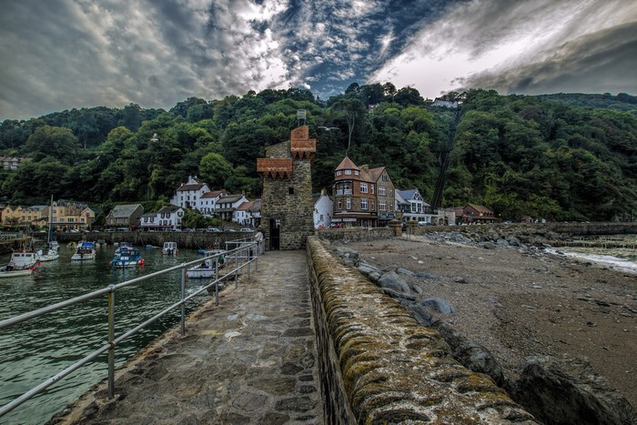 Lynmouth harbor with stone tower and houses