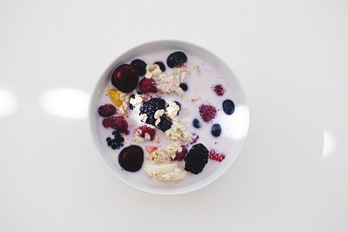 Bowl of muesli with berries and cherries