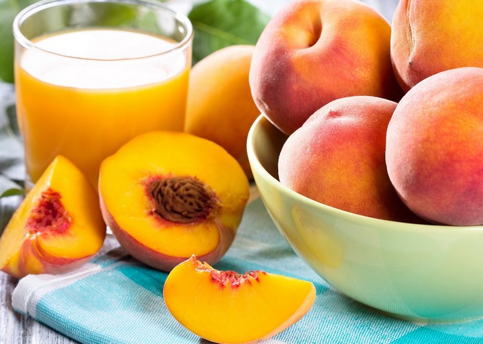 Peaches and Peach Juice on a Table
