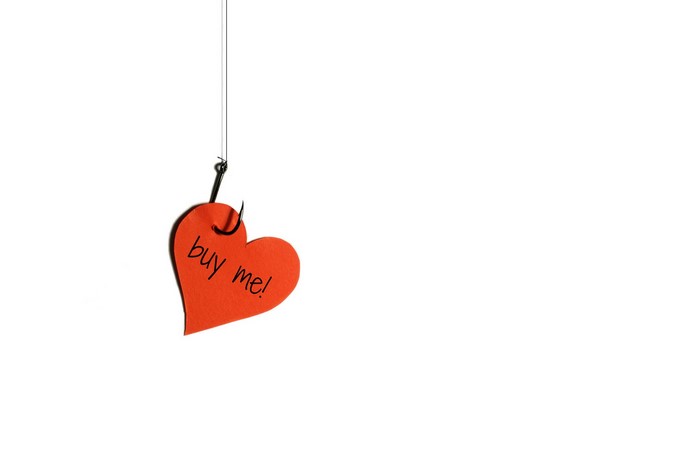 Red heart with "buy me!" on a fishing hook