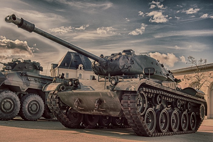 M41 Walker Bulldog tanks with building and sky