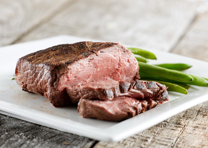 Sliced beef steak with green beans