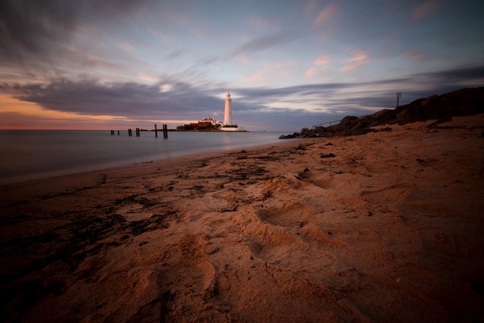 St. Marys Lighthouse on the coast of England at sunset
