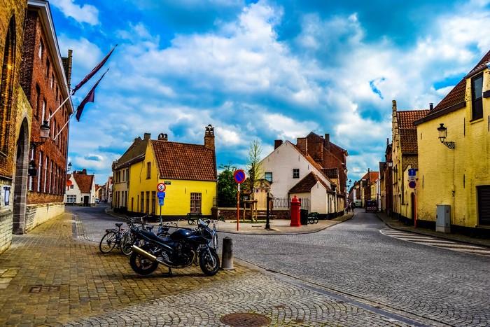 Street in Bruges, Belgium with Houses and Motorcycles