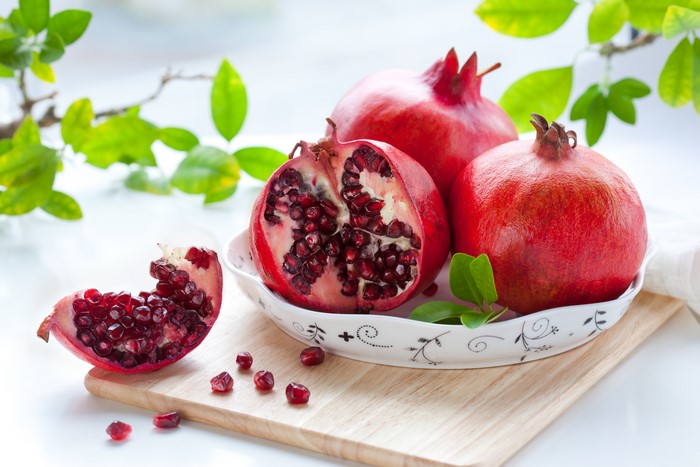 Pomegranates on a wooden board