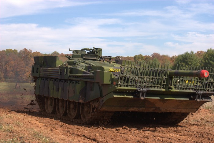 Strv 103 tank in a muddy field