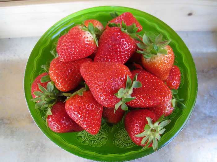 Strawberries in a green bowl
