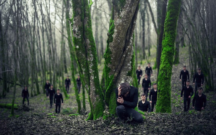 Men in a mossy forest